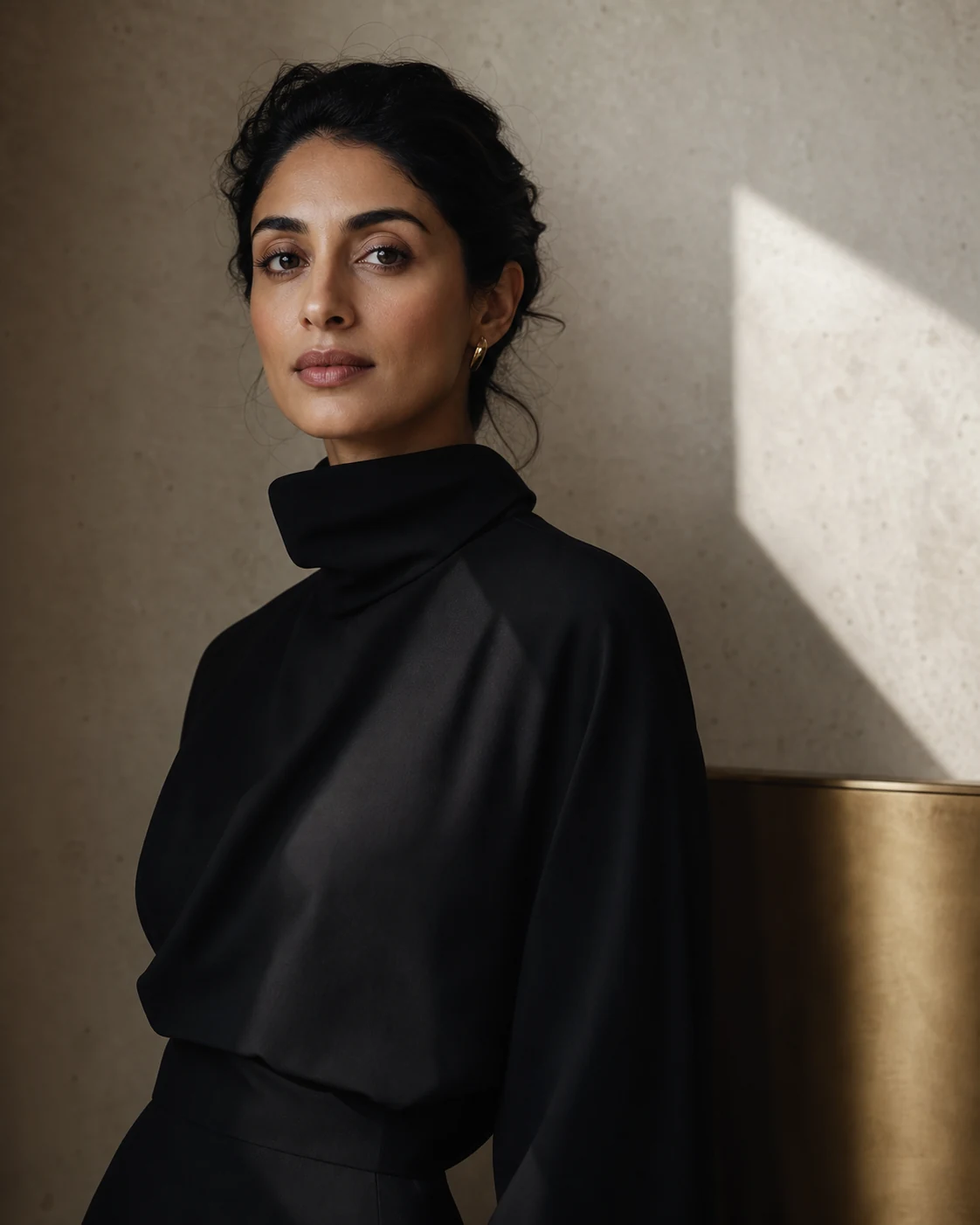 Portrait of a woman in a sculptural black garment